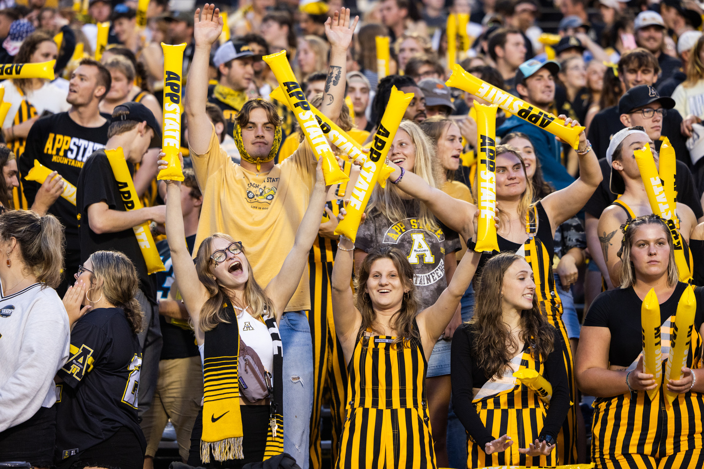 App State Football fans displaying a variety of trademarked logos.